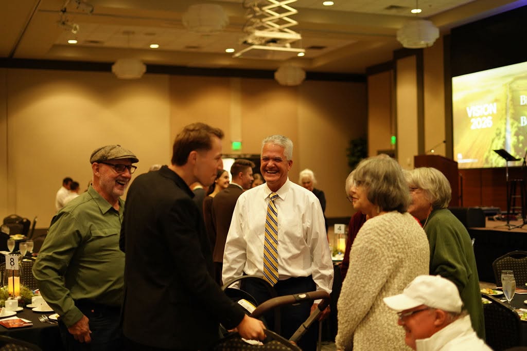 Friends greeting each other at the banquet